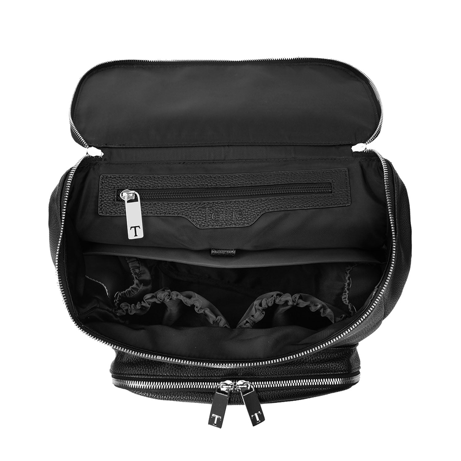 Top view of the unzipped main compartment of a black leather nappy backpack with silver hardware on a white background from Tottie.