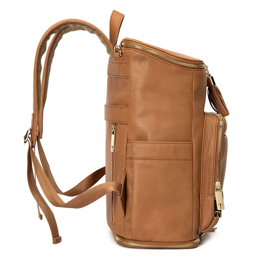 A tan colour leather baby backpack with gold zippers on white background